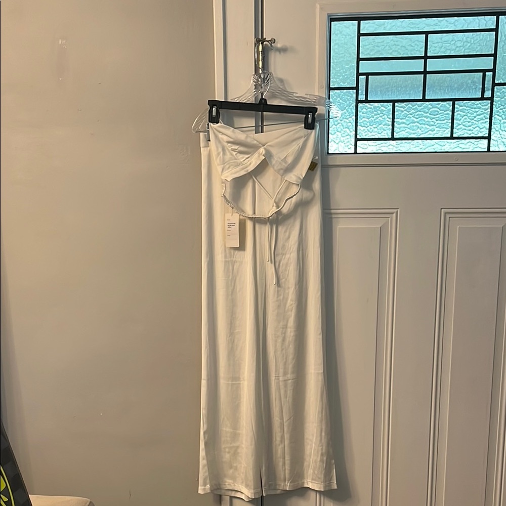 NWT 2 pc set. Bralette runs small. Pant waist 13 in wide inseam 32 in.
